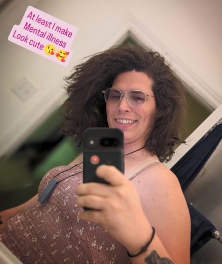 Harper smiling in a pink patterned dress
