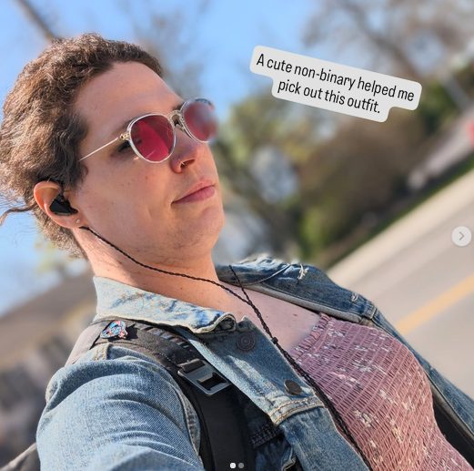 Harper outside in sunglasses, a pink top and denim vest